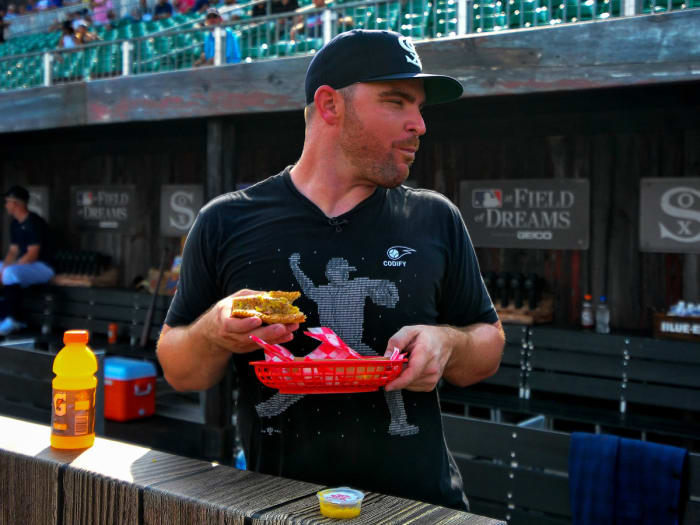 Aug 12, 2021; Dyersville, Iowa, USA; Chicago White Sox relief pitcher Liam Hendriks (31) takes in a meal before the game between the Chicago White Sox and the New York Yankees at Field of Dreams.